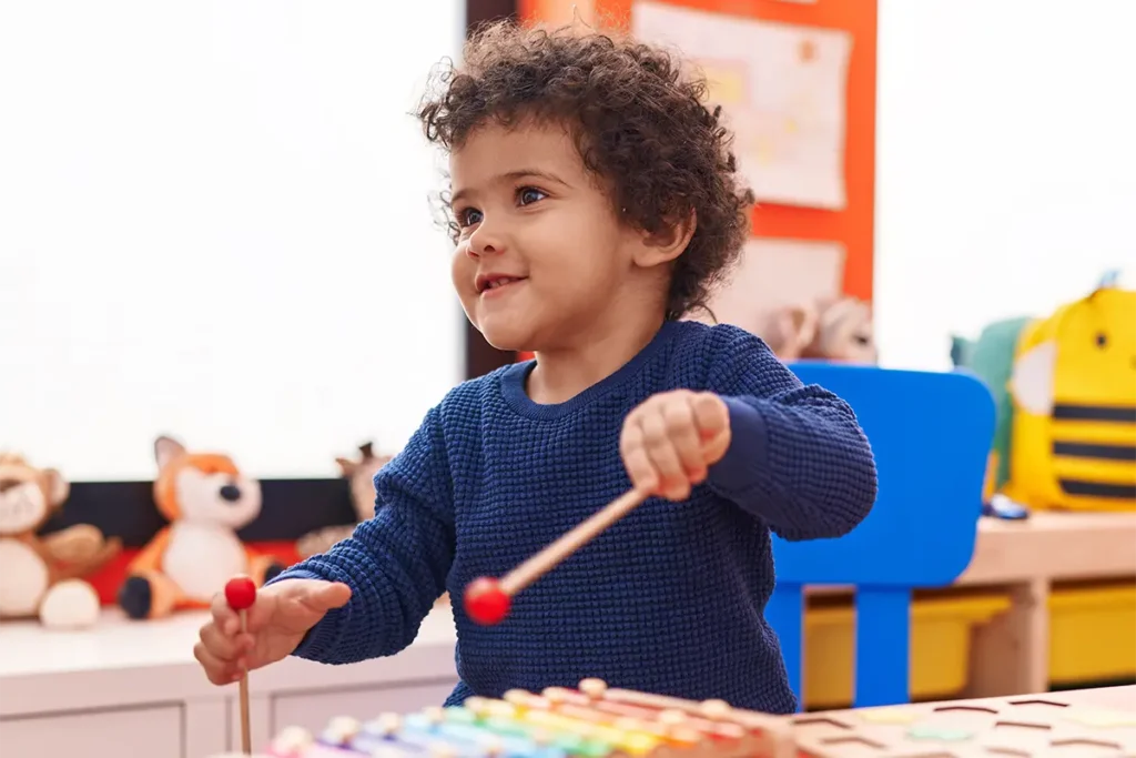 a child playing the xylophone